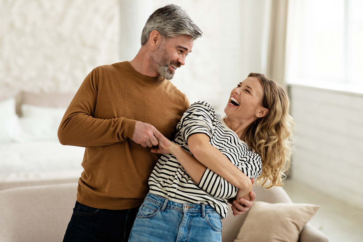 Joyful Couple Dancing Having Fun At Home. Loving Husband And Wife Having Date Hugging And Laughing Indoors. Romantic Relationship And Happy Marriage Concept