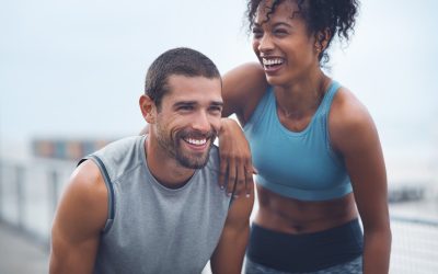 Shot of a sporty young couple taking a break while exercising outdoors.